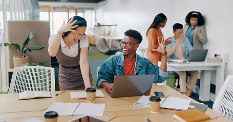 Image showing Teamwork, laptop and business people fist bump in office for success celebration. Training, coaching and Asian woman teaching black man, support and advice while celebrating after solving problem.