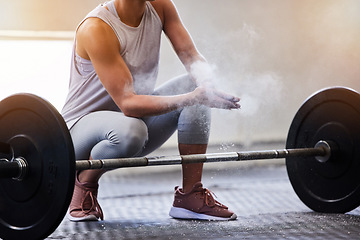 Image showing Hands, weightlifting and powder with a woman bodybuilder getting ready to exercise or workout at gym. Fitness, grip and training with a female weight lifter bodybuilding for strong muscles or health