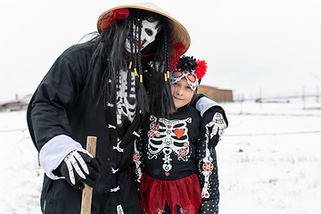 Image showing Peoples in mask attend Masopust or the Mardi Gras carnival, traditional ceremonial door-to-door procession. 