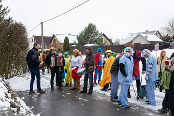 Image showing Peoples in mask attend Masopust or the Mardi Gras carnival, traditional ceremonial door-to-door procession. 