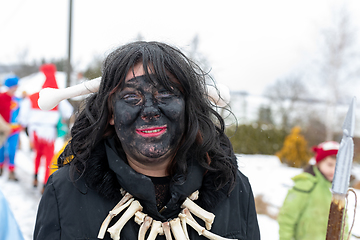 Image showing Peoples in mask attend Masopust or the Mardi Gras carnival, traditional ceremonial door-to-door procession. 