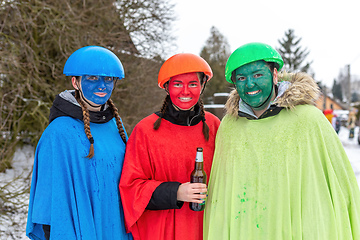 Image showing Peoples in mask attend Masopust or the Mardi Gras carnival, traditional ceremonial door-to-door procession. 