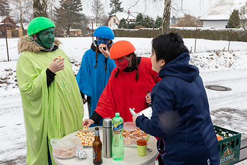 Image showing Peoples in mask attend Masopust or the Mardi Gras carnival, traditional ceremonial door-to-door procession. 