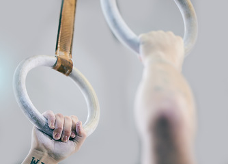 Image showing Gymnast rings, fitness and hands zoom in a health, wellness and training center. Hand powder zoom, athlete and action performance of a man doing sports, gymnastics and competition with strength