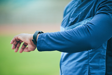 Image showing Time, watch and hand of a fitness man watching fitness, run and training results on a smartwatch. Workout tech, sports and exercise app monitor outdoor with an athlete with blurred background