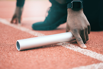 Image showing Black man, relay runner hands and marathon of a fitness, workout and sport exercise on asphalt. Stadium, baton hand zoom and start line of a athlete ready for field running on outdoor training ground