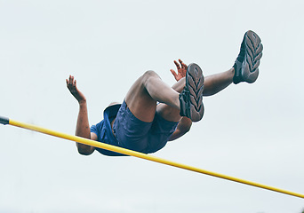Image showing Fitness, athletics high jump by man at a stadium for training, energy and cardio against sky background. Jumping, athlete and male outdoors for performance, endurance and competition on mock up