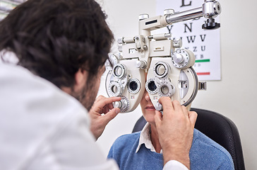 Image showing Eye care, test or exam for patient and doctor AT optometry consultation for lens or frame for vision. Woman and man healthcare person with machine for eyes, eyesight and health insurance examination