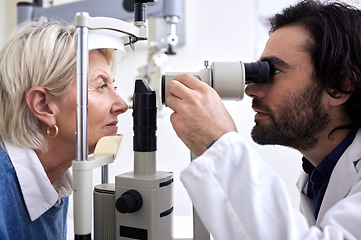 Image showing Optometry, machine exam and woman with an optometrist for a vision check, eye consultation and test. Healthcare, help and male optician with a senior patient to measure visual eyesight with equipment