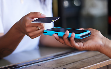 Image showing Tapping, payment and hands with a credit card and machine to pay for a service at a coffee shop. Finance, contactless transaction and woman buying at a cafe, restaurant or shop with a waiter