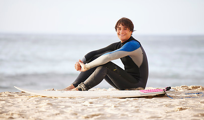 Image showing Happy, surfing and portrait of a man at the beach for water sports, happiness and holiday in Bali. Smile, training and surfer with a board for exercise, ocean break and activity on a vacation
