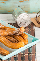 Image showing Traditional churros with hot chocolate 