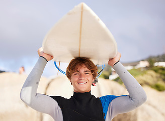 Image showing Beach, surfing and portrait of a man with a board for start of summer, fitness and relaxation. Exercise, smile and young surfer ready for training at the sea in the ocean on a holiday in Thailand