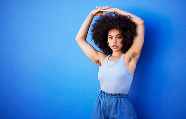 Image showing Body positivity, empowerment and portrait of a woman with hair isolated on a blue background. Beauty, natural and African girl showing armpit with confidence, feminism and attractive on a backdrop