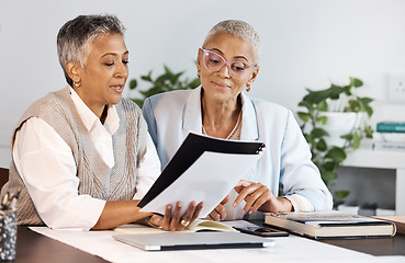 Image showing Collaboration, documents and meeting with a business team planning while working together in an office. Teamwork, strategy or partnership with a female employee and colleague at work for growth