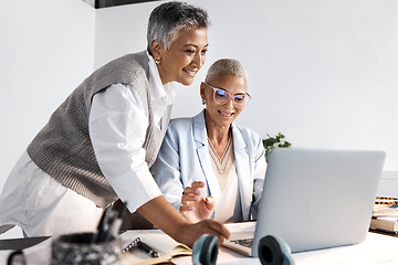 Image showing Laptop, collaboration and support with a woman manager training an employee in the office at work. Computer, teamwork and help with a female coach or supervisor at an employee desk for assistance