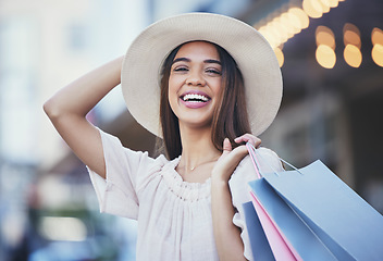 Image showing Woman, shopping and portrait smile in the city carrying bags for discount, deal or purchase. Happy female shopper smiling in joyful happiness for luxury, fashion gifts or sale in an urban town