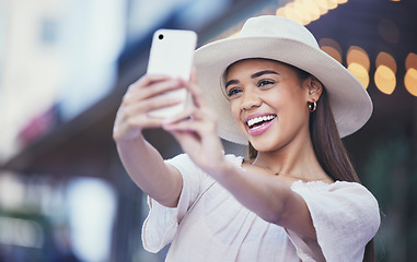 Image showing Woman, vlogger and social media with smile in the city for selfie, travel or profile picture and memories. Happy female influencer smiling for vlog, traveling or online 5G connection in an urban town