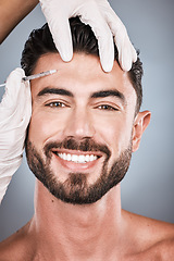 Image showing Needle, man and portrait for skincare, beauty and collagen aesthetic in studio. Botox cosmetics, face injection and male model smile for plastic surgery, transformation or facial filler on background