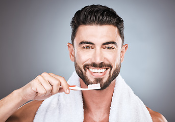 Image showing Man, toothbrush and portrait smile for dental care, hygiene or skincare against a gray studio background. Happy male face smiling for clean teeth, oral or brushing mouth for morning grooming routine