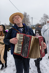 Image showing Peoples in mask attend Masopust or the Mardi Gras carnival, traditional ceremonial door-to-door procession. 