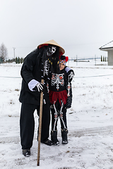 Image showing Peoples in mask attend Masopust or the Mardi Gras carnival, traditional ceremonial door-to-door procession. 