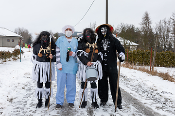 Image showing Peoples in mask attend Masopust or the Mardi Gras carnival, traditional ceremonial door-to-door procession. 