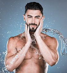 Image showing Water splash, face and shower with man in portrait for beauty and skincare isolated on studio background. Smile, facial and cleaning body with muscle, sustainable dermatology with natural cosmetics