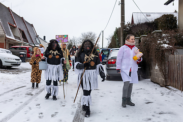 Image showing Peoples in mask attend Masopust or the Mardi Gras carnival, traditional ceremonial door-to-door procession. 