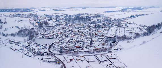 Image showing Aerial view of village with residential buildings in winter.