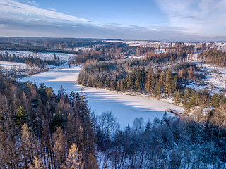 Image showing Aerial top down view of beautiful winter forest treetops.