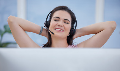 Image showing Relax, success or consultant in call center with a happy smile on target for winning a telemarketing bonus. Contact us, easy or sales woman in customer services stretching after crm goals or b2b deal