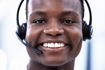 Image showing Crm, portrait or happy black man consulting in call center helping, consulting or talking at customer support. Smile, face or African sales consultant in a telemarketing or communications company