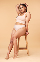 Image showing Woman in portrait with underwear, plus size and body positivity, fitness and beauty with skin isolated on studio background. Health, wellness and person with nutrition, cellulite and dermatology