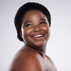 Image showing Face, thinking and beauty with a model black woman in studio on a gray background for skincare. Idea, skin and happy with a plus size young female posing indoor for natural care or body positivity