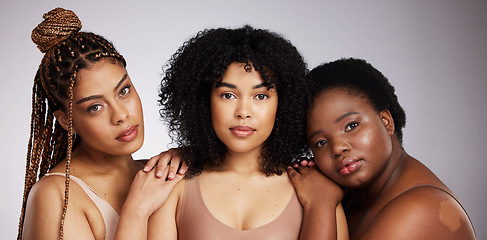 Image showing Portrait, skincare and diversity with woman friends in studio on a gray background together for beauty. Face, makeup and natural with a female model group posing to promote support or inclusion