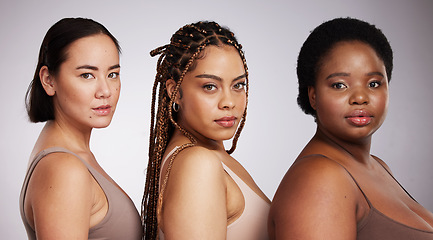 Image showing Women, diversity and studio portrait with support for trust, underwear or skincare for beauty aesthetic. Model, asian and black woman with inclusion, makeup or wellness with skin health by background