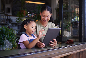 Image showing Digital tablet, cafe and mother with her child reading the online menu before ordering. Technology, internet and mom on a date with her girl kid with a touchscreen mobile device in a coffee shop.