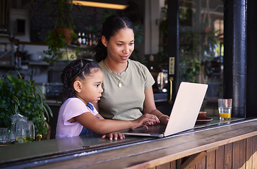 Image showing Black family, internet cafe or laptop with a mother and daughter together in the window of a restaurant. Kids, computer or education with a woman and female child sitting or bonding in a cafe