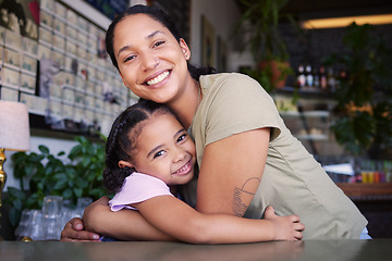 Image showing Cafe, portrait and mother hug kid in coffee shop for love, care or quality time together. Happy parent hugging girl child in restaurant at table of happiness, smile and embrace for bond, relax or fun