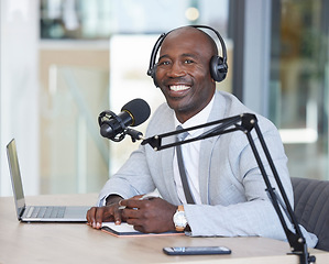 Image showing Portrait, laptop and news with a black man radio presenter writing in a notebook during a live broadcast. Computer, podcast and microphone with a male journalist working in media for a talk show