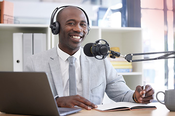 Image showing Portrait, laptop and radio with a black man presenter writing in a notebook during a live broadcast. Computer, podcast and microphone with a male journalist working in media for a talk show or press