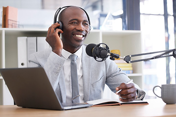 Image showing News, laptop and radio with a black man presenter writing in a notebook during a live broadcast. Computer, podcast and microphone with a male journalist working in media for a talk show or press