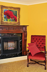 Image showing Fireplace and red chair