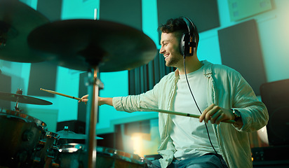 Image showing Music, drums and band with a man musician in a studio for a recording, performance or practice. Art, instrument and sound with a young male drummer expressing musical or artistic talent in a studio