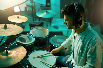 Image showing Music, drums and instrument with a man musician in a studio for a recording, performance or practice. Art, band and sound with a young male drummer expressing musical or artistic talent in a studio