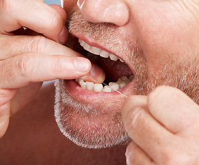 Image showing Dental, hands and mouth of man with floss in studio isolated on background for health. Oral hygiene, wellness and face of senior male model with thread or string for flossing, cleaning or teeth care.