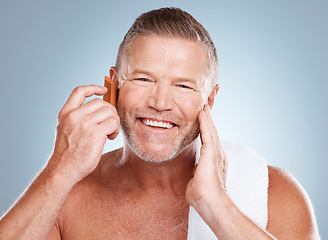 Image showing Skincare, grooming beard and portrait of man with comb for wellness, cleaning and hygiene on blue background. Salon aesthetic, beauty and face of male with barber tools for facial, hair care and skin