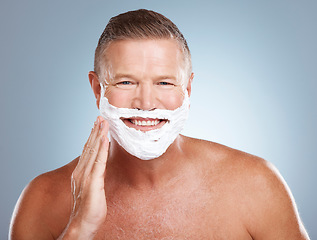 Image showing Shaving cream, happy and portrait of old man in studio for skincare, grooming and beauty on grey background. Face, foam and hair removal for mature model smile for skin, beard and shampoo product