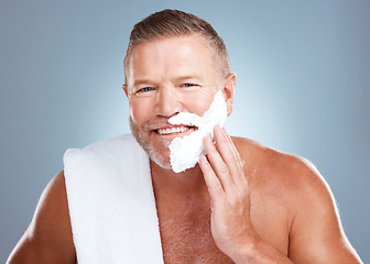 Image showing Shaving beard, smile and man portrait with cream and razor for face cleaning, wellness and skincare. Morning grooming, foam and model with facial care and skin treatment to shave hair in a studio